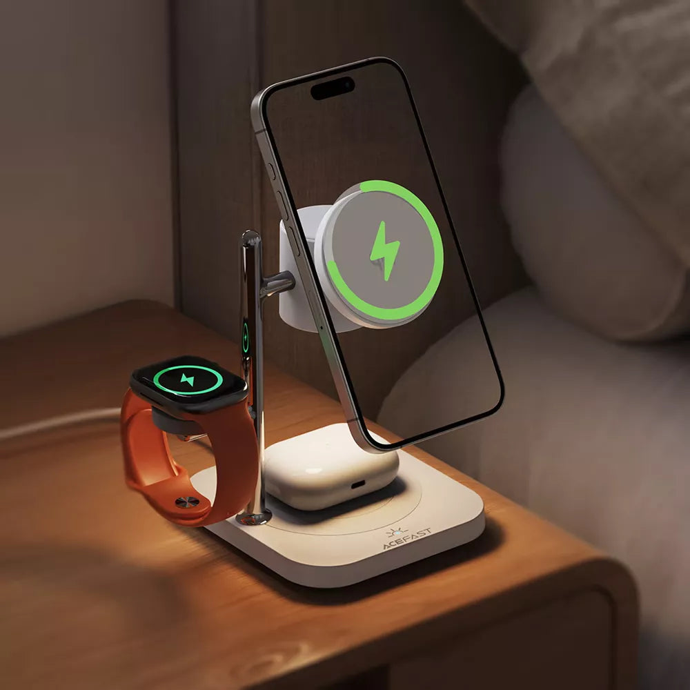 White Acefast Qi2 charging pad with an upright phone mount, earbuds area and watch pad.
