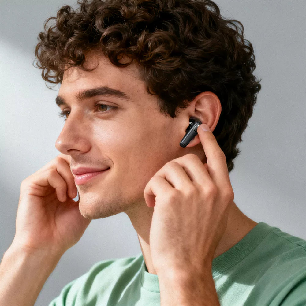 Black Acefast wireless earbuds sitting in their open charging case.